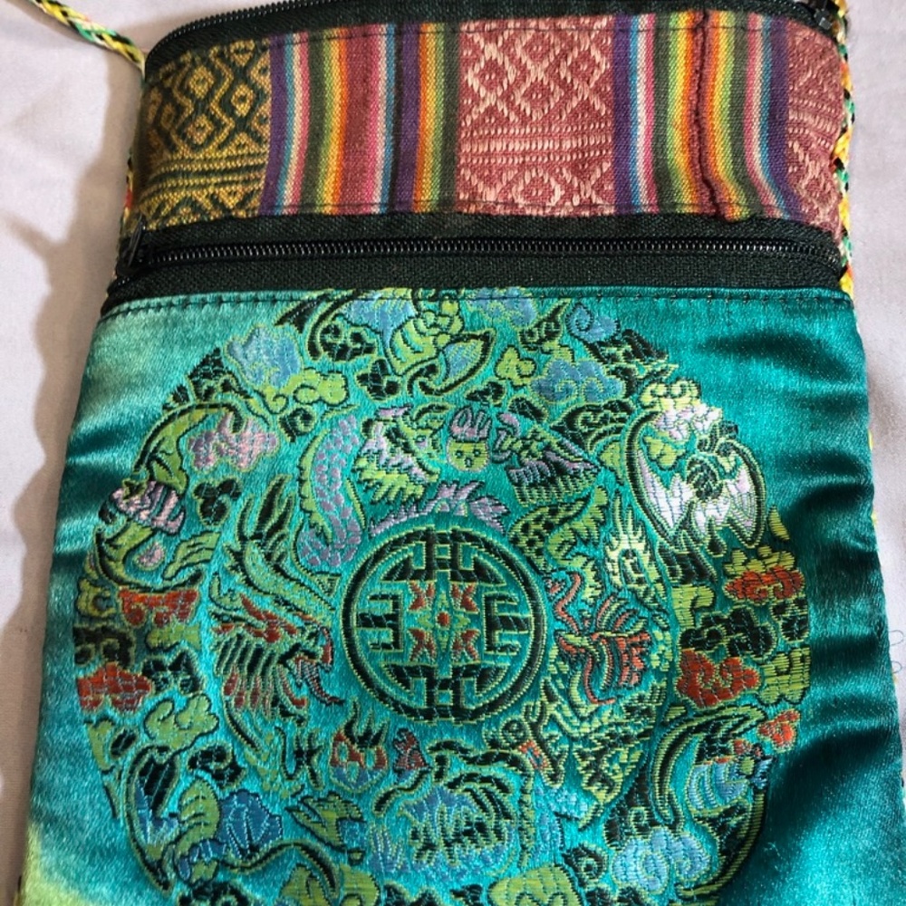 Small purse over shoulder. Green + stripe design